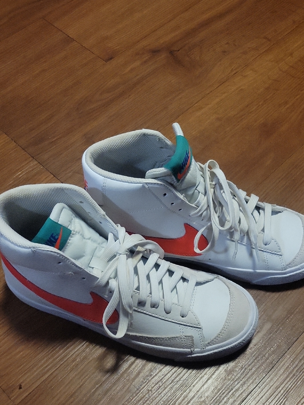 Nike White High-Top Sneakers with Coral Swoosh and Teal Tongue Label